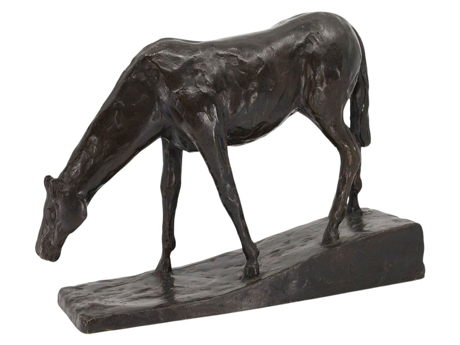 A BRONZE HORSE, AFTER EDGAR DEGAS (1834–1917), FRENCH, 20TH CENTURY: A finely cast bronze of a grazing horse, after the well-known wax and clay studies by Edgar Degas. The sculpture captures Degas’ characteristic attention to anatomical structure and natural posture: