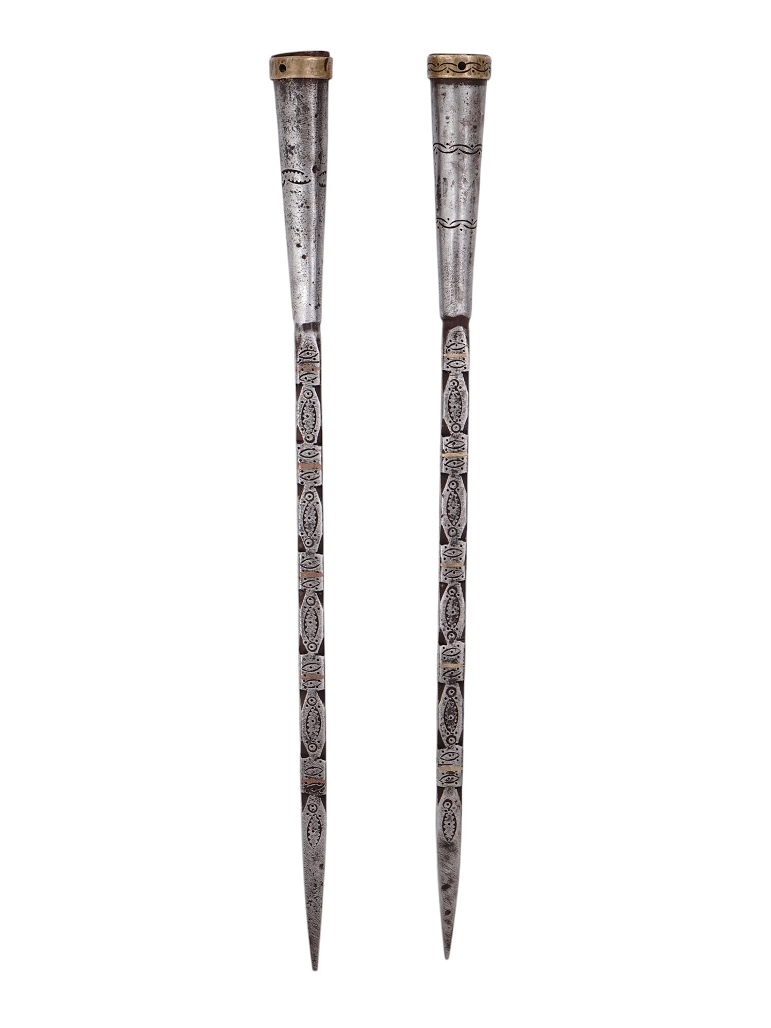 A PAIR OF INDO-PERSIAN CHASED STEEL SPEAR BUTTS, 18TH OR 19TH CENTURY: A pair of Indo-Persian steel spear butts decorated with chased patterns and beveling, as well as bands of inlaid brass along its length. Spear butts would have been attached to the reverse end of a sp