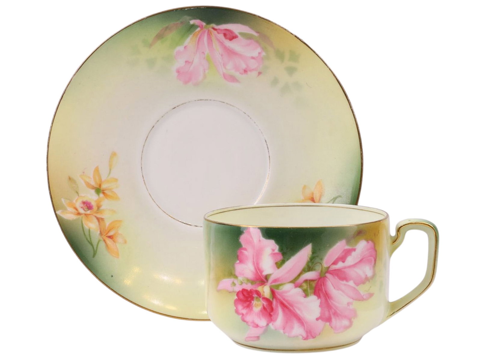 RS PRUSSIA PORCELAIN TEACUP AND SAUCER WITH ORCHID DECORATION, SUHL, GERMANY, CIRCA 1898–1916: A fine matched porcelain teacup and saucer by RS Prussia (Reinhold Schlegelmilch), of thin eggshell body, each piece decorated with hand-painted orchid blossoms against a softly airbrushed ground shad