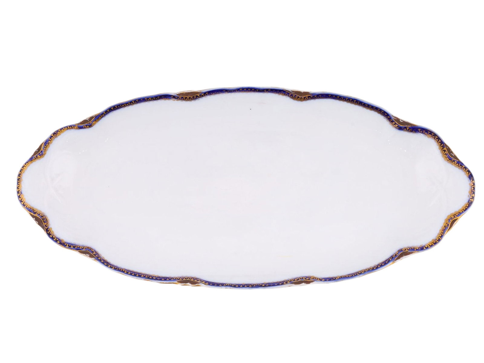 A RUSSIAN KUSNETSOV PORCELAIN FISH DISH, C. 1900: A finely crafted porcelain fish dish produced by the famed Kusnetsov porcelain factory during the waning decades of Imperial Russia. The dish is of a relatively simple oval form, with its rim painted