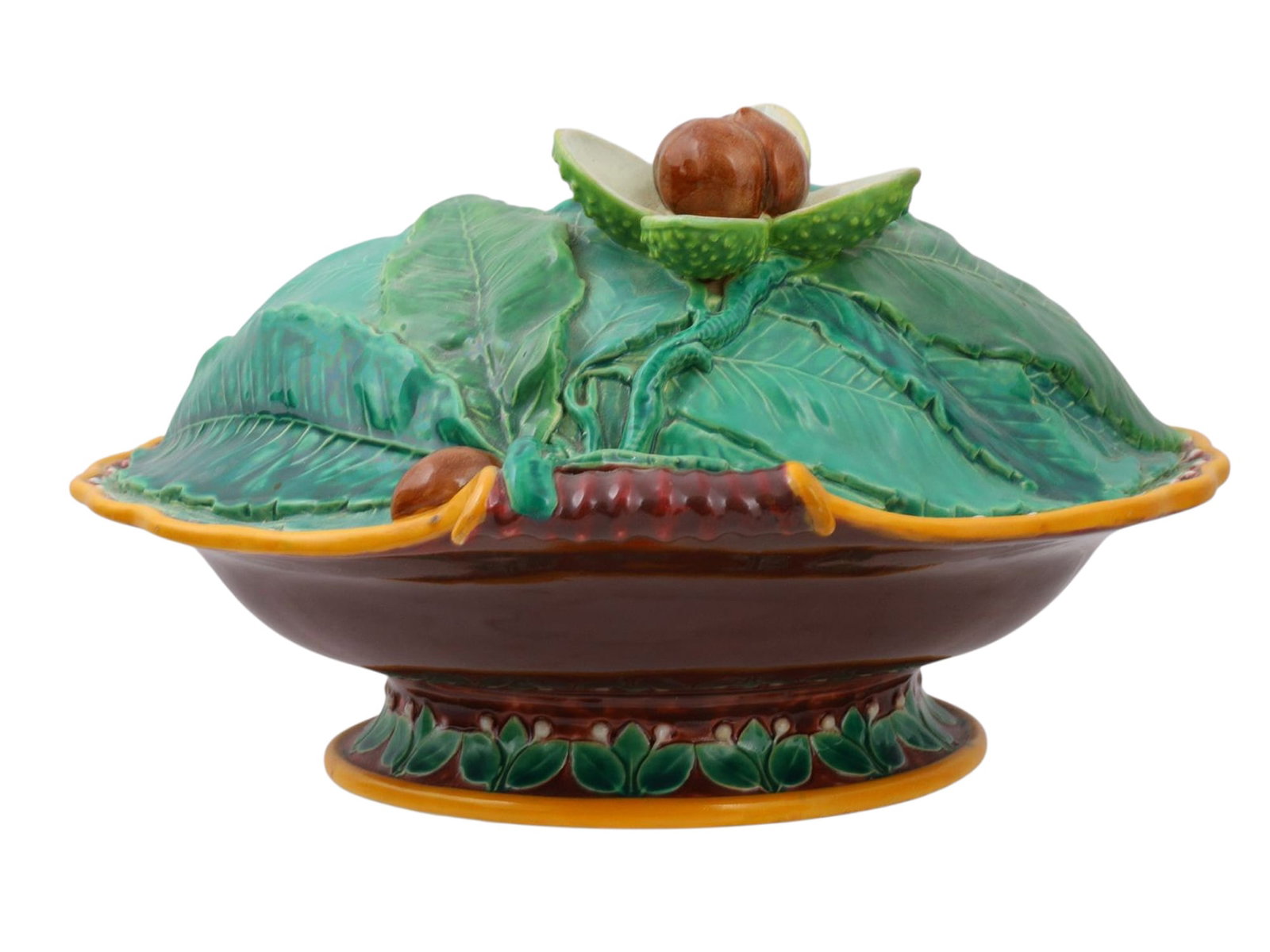 AN ENGLISH MAJOLICA CHESTNUT-FORM BOWL, LATE 19TH CENTURY: Of oval form, the scalloped rim and pedestal foot enriched with green foliate borders, the bowl interior and underside glazed in turquoise. The exterior is modeled with large green leaves, chestnuts,