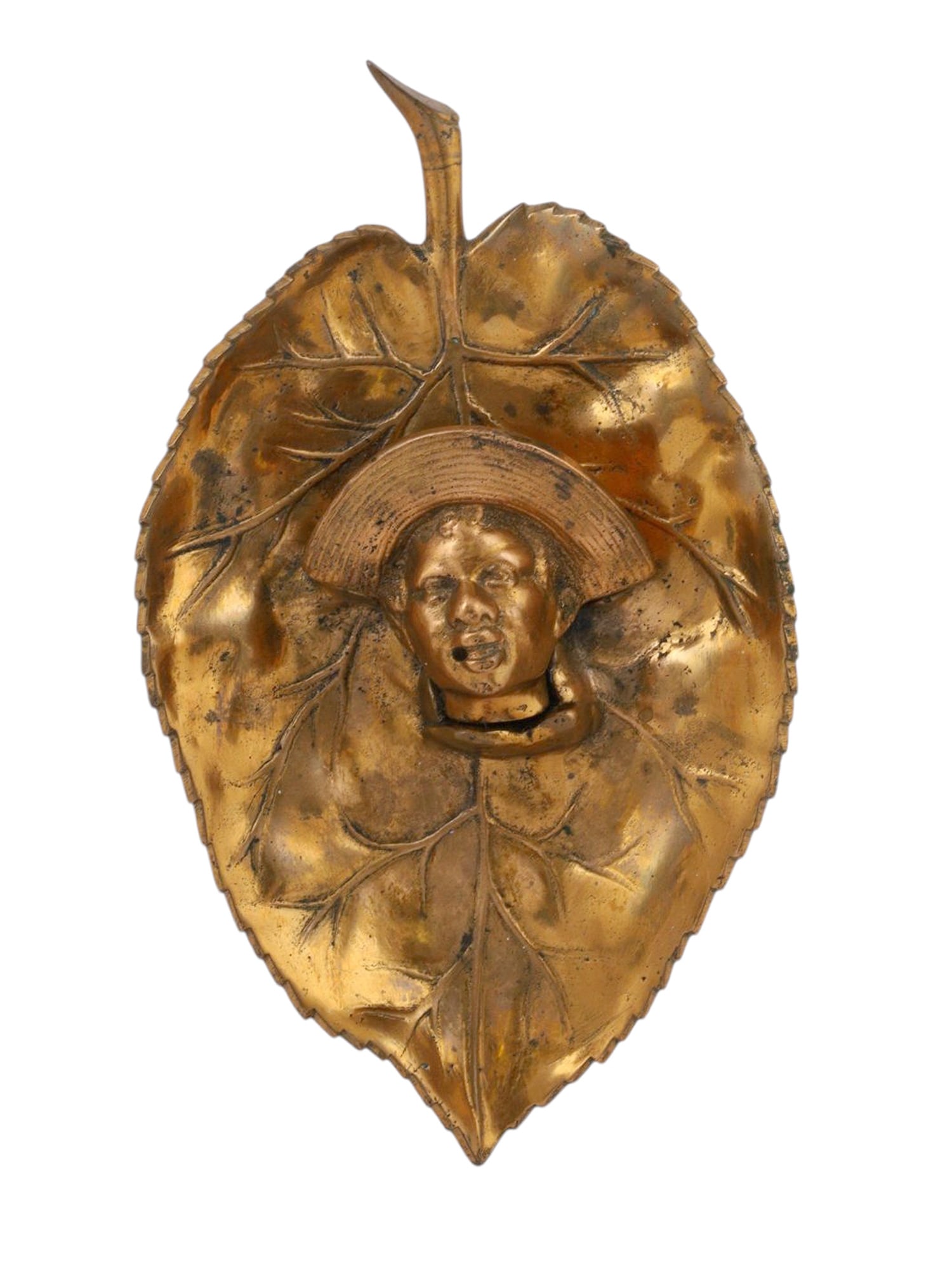 POSSIBLY JOHNNY GRIFFIN (AMERICAN, ACTIVE LATE 19TH CENTURY), A GILT-BRONZE TOBACCO LEAF TRAY WITH: Cast in the form of a large tobacco leaf with detailed veining, the center modeled in high relief with the bust of an African man wearing a broad-brimmed straw hat, his head slightly tilted upward. Th