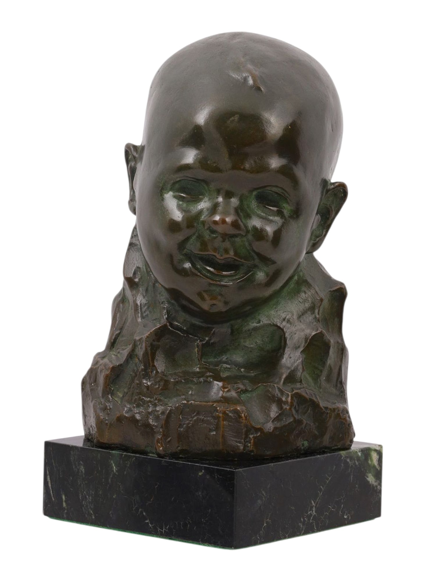 A SIGNED MICHEL JACOBS BRONZE BUST OF AN INFANT, 20TH CEN.: A bronze bust of a smiling baby set atop a black marble base. The piece is signed on the back with the name of the artist 'Michel Jacobs'. Dimensions: H: 8 1/4 in., (21 cm.) Please make all inquiries
