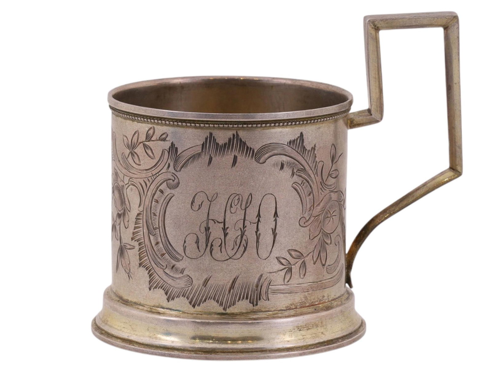 A RUSSIAN SILVER TEAGLASS HOLDER WITH FLORAL DECORATION, 19TH CEN.: A simple cylindrical cup holder with a rectangular handle, featuring a minimalist engraved floral pattern. The upper rim is decorated with a narrow beaded border. There are hallmarks on the body, the 