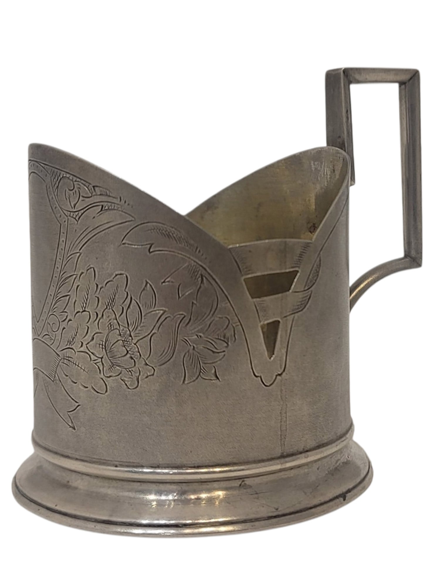 A SOVIET SILVER TEAGLASS HOLDER, ART NOUVEAU STYLE, EARLY 20TH CENTURY: Of tapering cylindrical form on a circular foot, with a sharply angular geometric handle. The body is engraved with stylized floral and foliate ornament framing a vacant shield-shaped cartouche, with 