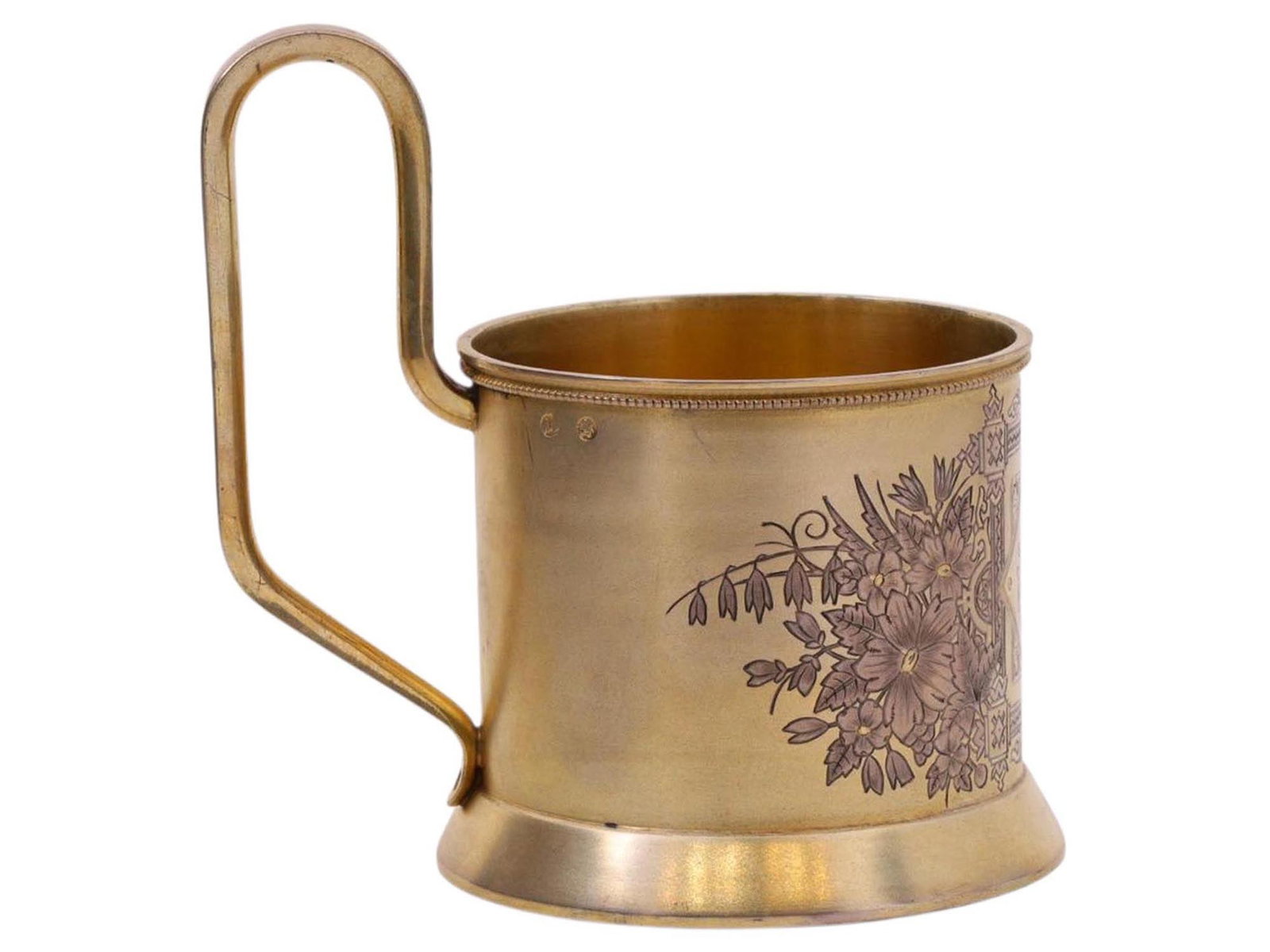 A RUSSIAN PARCEL-GILT SILVER TEA GLASS HOLDER (PODSTAKANNIK), 1891: A Russian parcel-gilt silver podstakannik of cylindrical form with a slightly flared base and applied strap handle of rounded rectangular section. The body is finely engraved with a symmetrical compos