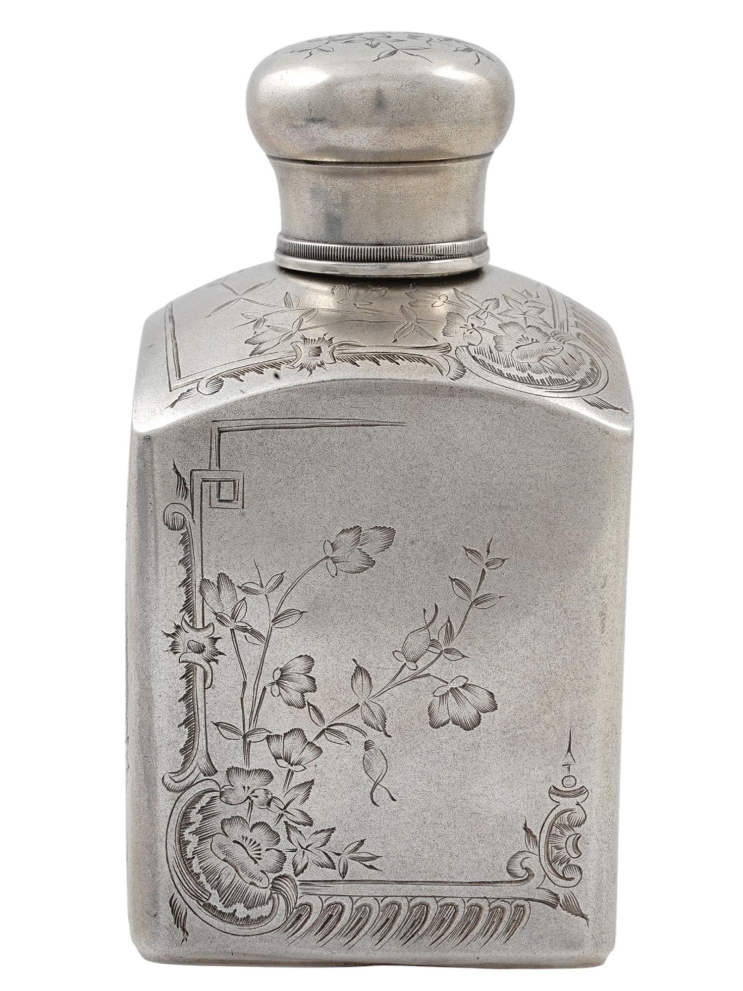 A RUSSIAN ENGRAVED SILVER TEA CADDY WITH FLORAL MOTIFS, 19TH CENTURY: A silver tea caddy which has been decoratively chased with intricate floral motifs on each of its 4 sides as well as its convex top. The caddy is comprised of 3 pieces: the container, the lid, and a f
