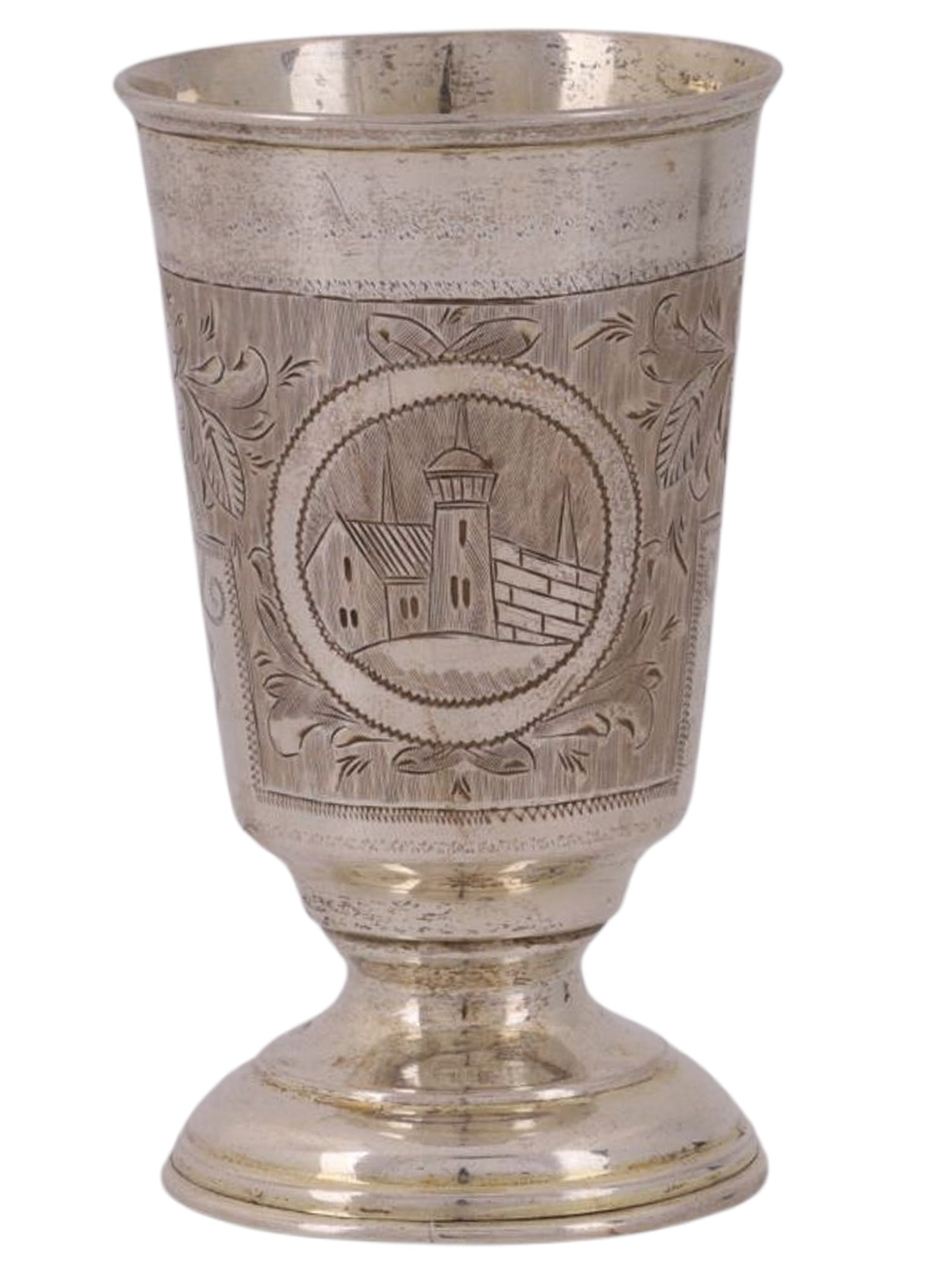 A RUSSIAN SILVER SHOT GLASS WITH CITY VIEW, M. DMITRIEV WORKSHOP, 1874: A conical-shaped shot glass on a small stem, decorated with an engraved floral and geometric pattern featuring medallions on both sides; the medallions are engraved with views of city walls and fortre