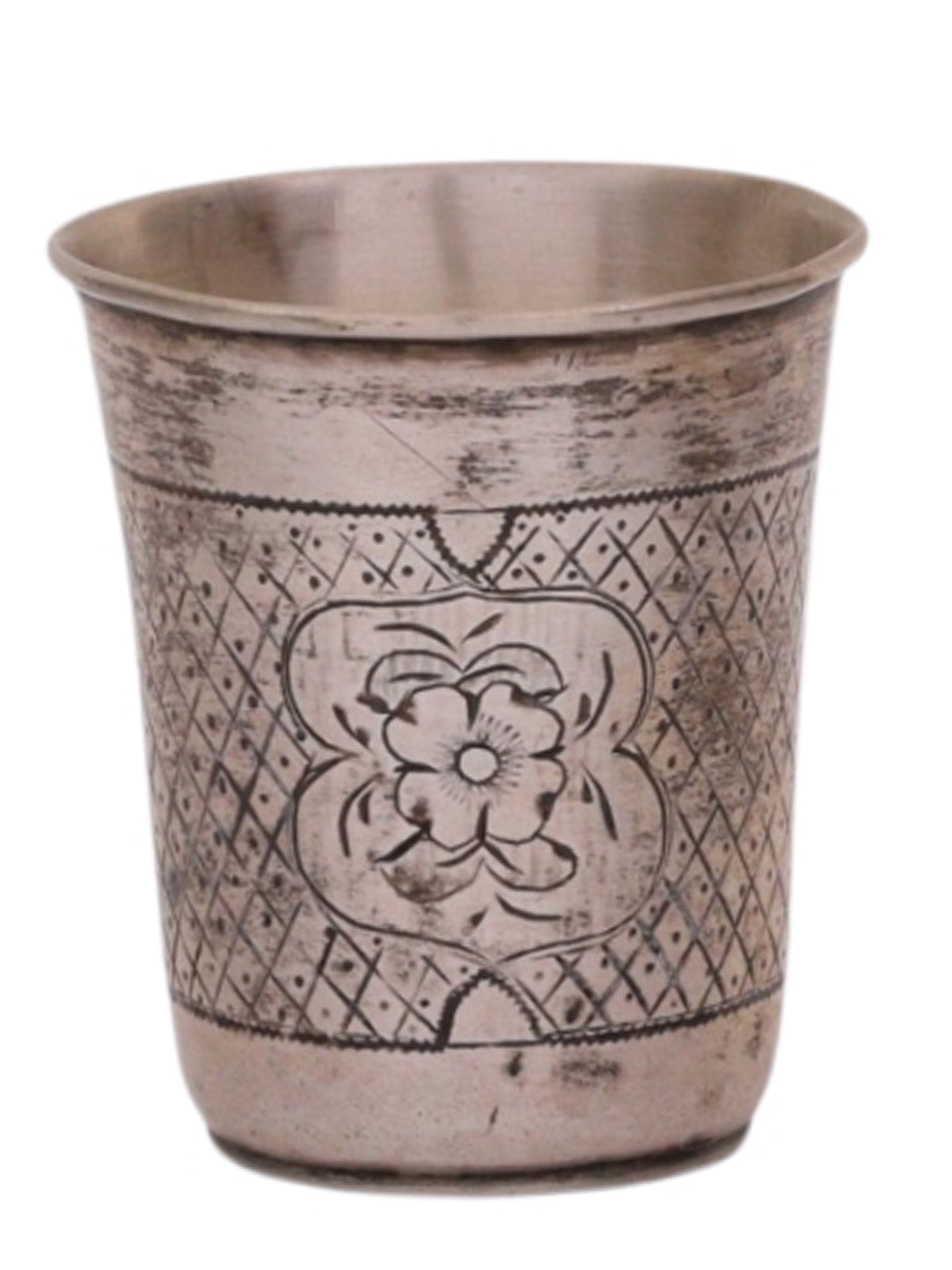 A RUSSIAN SILVER SHOT GLASS WITH ENGRAVED DECORATION, 1868: A Russian silver shot glass with Neo-Russian style engraving showing a flower against a dotted grid.Hallmarks: 'B.C' assayer's mark over 1868 date mark, 84 silver proof, St George Moscow mark.Weight: 