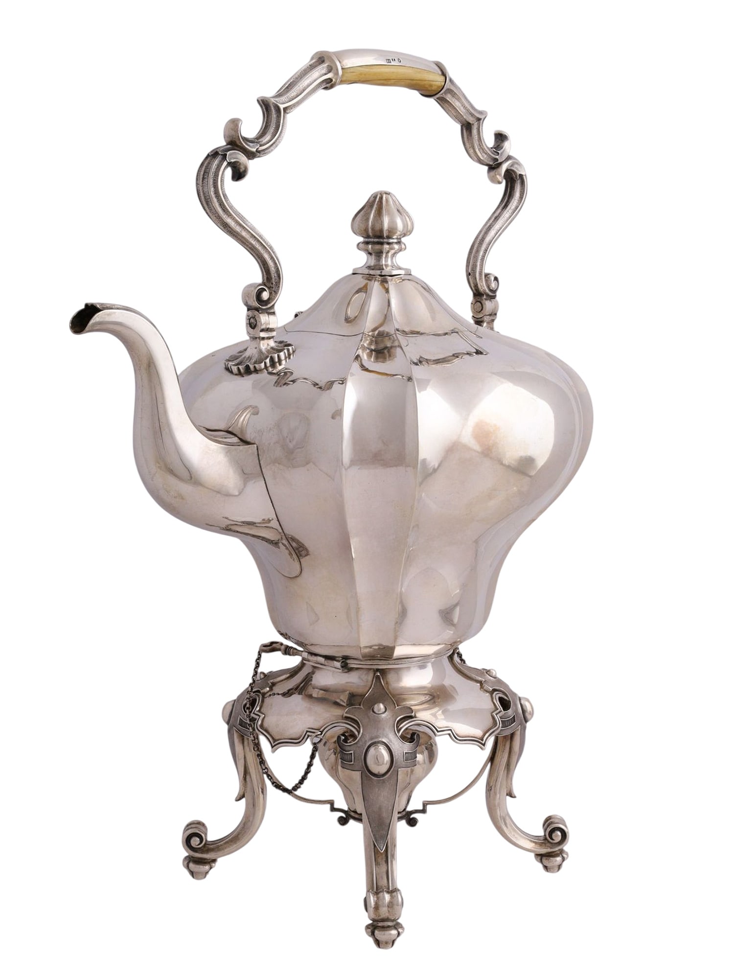 A RUSSIAN SILVER HOT-WATER KETTLE, SAZIKOV, ST. PETERSBURG, 1849: Of lobed baluster form, raised on four scrolling feet with a detachable stand, the body with a curved spout and hinged domed cover surmounted by a finial, the swing handle fitted with a turned wooden 
