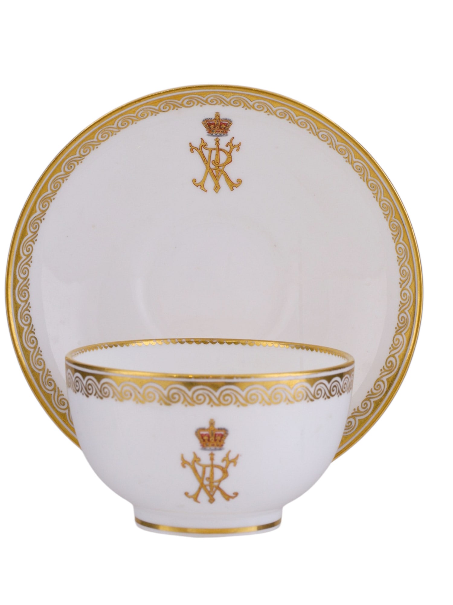 AN ENGLISH PORCELAIN CUP AND SAUCER, NIXON & SON WINDSOR, VICTORIA CYPHER: An English gilt porcelain cup and saucer by Nixon & Son of Windsor, stamped with their mark as well as the serial and/or style number of the items. Each plate is decorated on its surface with the 'VR'