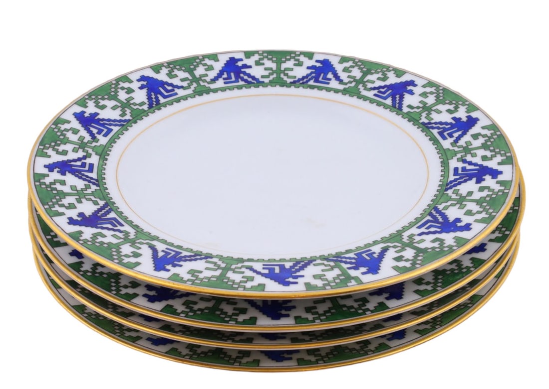 A LOT OF FOUR KORNILOV BROS. PORCELAIN PLATES, "GOLBEK" DESIGN, RUSSIA, CIRCA 1910: Comprising four porcelain plates decorated in the distinctive "Golbek" pattern, each with a broad border of stylized geometric ornament in cobalt blue and green on a white ground, the motif formed by 