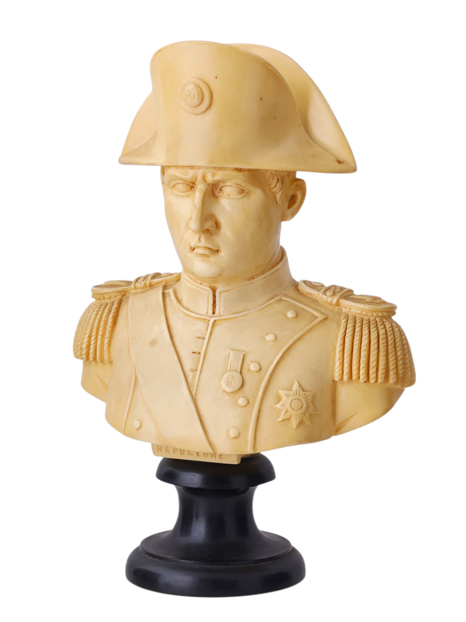 A CARVED BUST OF NAPOLEON, SIGNED G. RUGGERI, ITALY, LATE 19TH CENTURY: A finely detailed bust depicting Napoleon Bonaparte wearing a bicorne hat and military uniform, decorated with epaulettes and orders. The bust is inscribed "NAPOLEONE" on the front base and bears the 