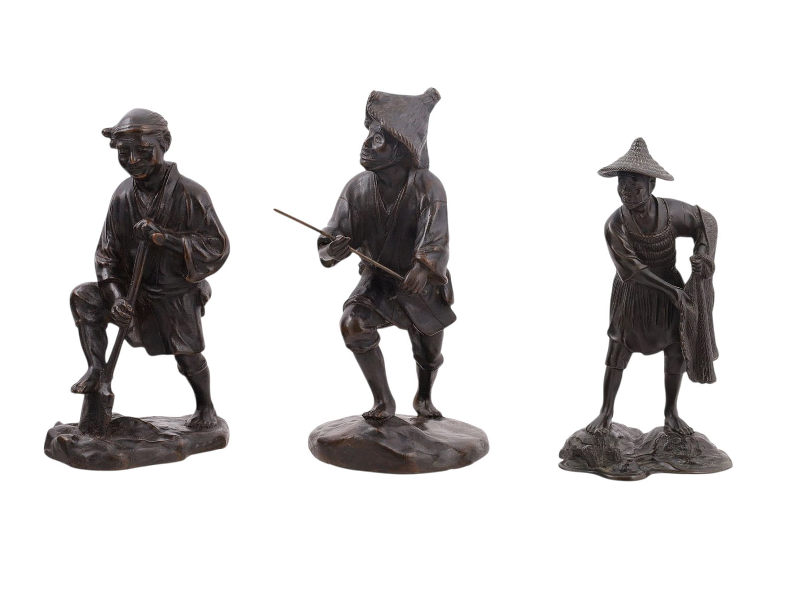 A LOT OF THREE JAPANESE BRONZE FIGURES OF PEASANTS, MEIJI PERIOD (LATE 19TH?EARLY 20TH CENTURY): Comprising three finely cast and patinated bronze figures, each naturalistically modeled as a Japanese peasant in traditional attire, engaged in rural occupations. One depicts a fisherman wearing a wo