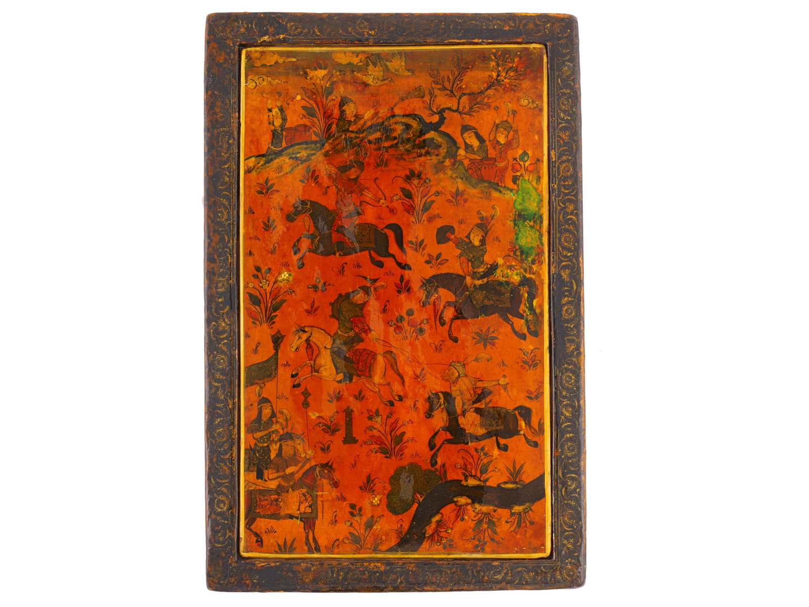 A PERSIAN QAJAR LACQUER MIRROR CASE (AINEHDAN), 19TH CENTURY: Finely painted and lacquered papier-mâché mirror case (ainehdan) of rectangular form, the interior decorated with lively hunting and equestrian scenes set within a stylized landscape populat
