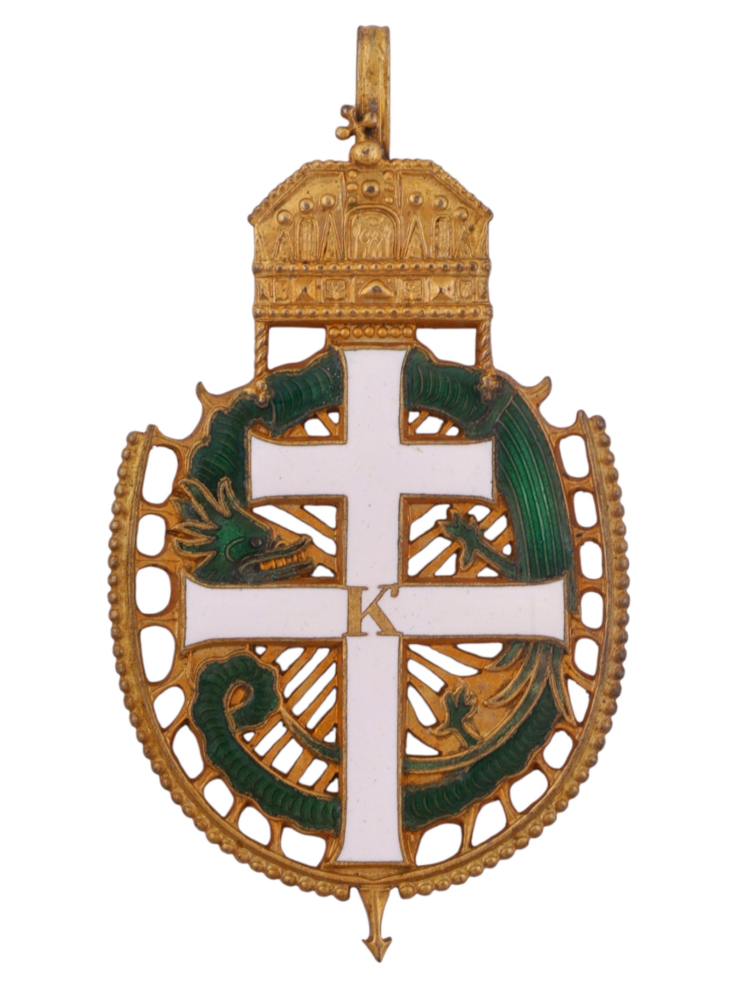 A HUNGARIAN CHRISTIAN NATIONAL DEFENSE ASSOCIATION (MOVE) MEMBERSHIP BADGE, CIRCA 1920S?1930S: Gilt and polychrome enameled badge of oval openwork form surmounted by the Hungarian Holy Crown. The center is dominated by a white cross over a green dragon coiled around a radiant sunburst, with the