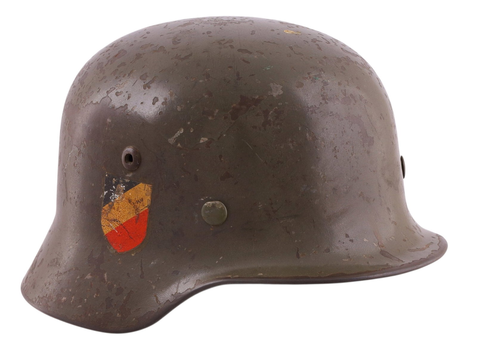 A GERMAN M40 DOUBLE-DECAL HEER STEEL HELMET, WORLD WAR II: A German Wehrmacht Model 1940 (M40) steel combat helmet retaining both the national tricolor shield on the right side and the Heer eagle decal on the left. The M40 pattern is distinguished by its stam