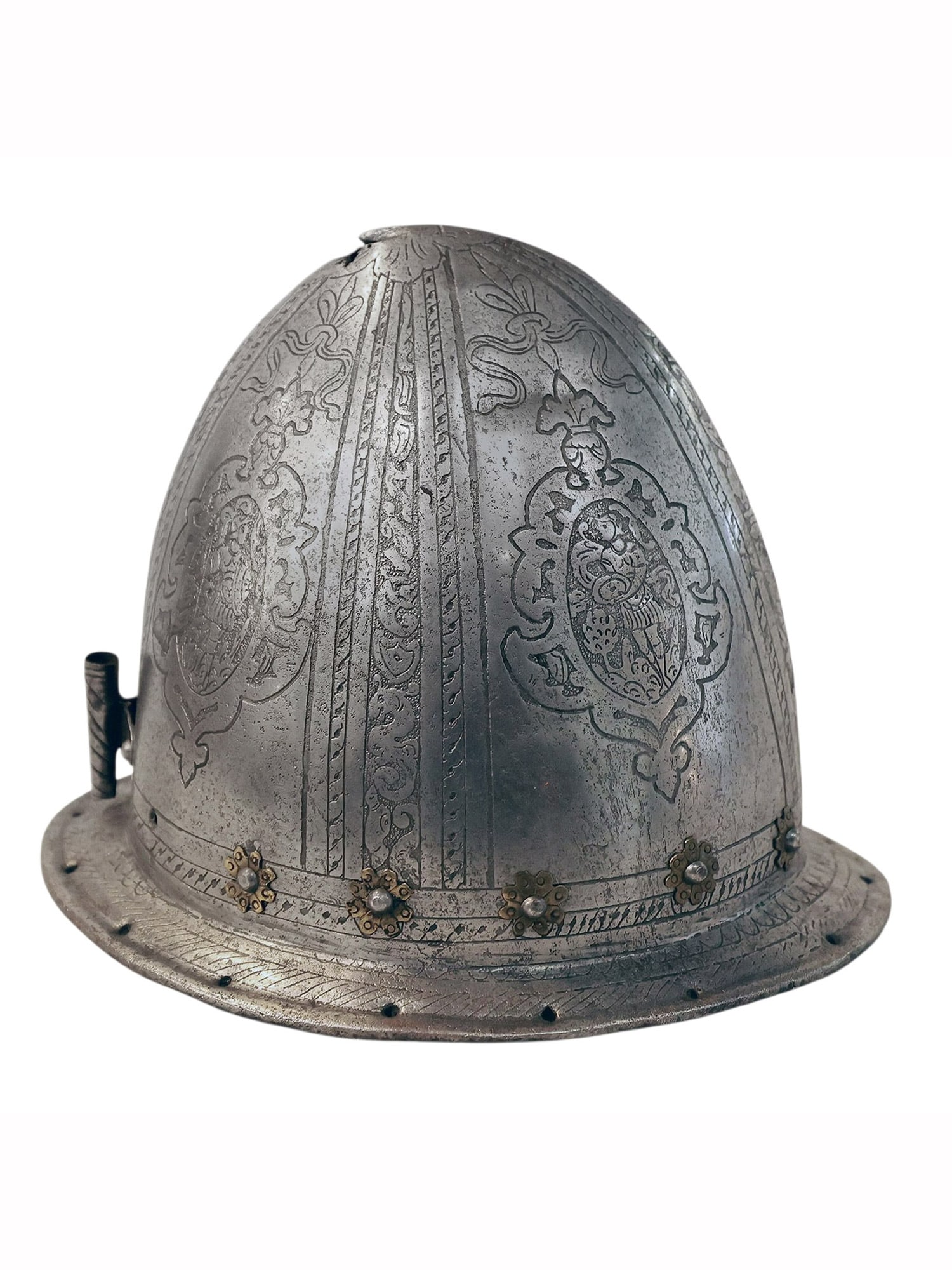 A FINELY ENGRAVED EUROPEAN CABASSET HELMET, MILAN, ITALY, 16TH CENTURY: Of classic almond-shaped form with a slightly pointed apex and turned brim, the steel surface is decorated with deeply etched bands of foliate scrollwork and strapwork enclosing cartouches bearing arm