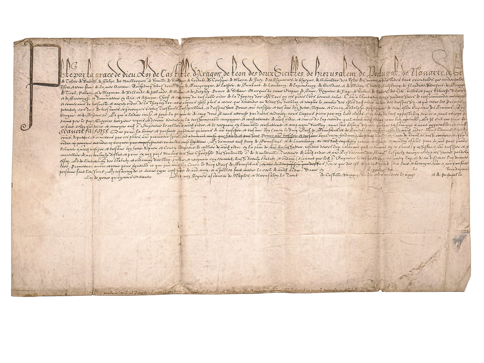 A RARE 1585 PHILLIP II OF SPAIN VELLUM DOCUMENT: An early modern royal decree or legal document, handwritten in formal old French, with strong Spanish royal styling. It begins with an elaborate titulature:"Par le roy par la grâce de Dieu Roy de