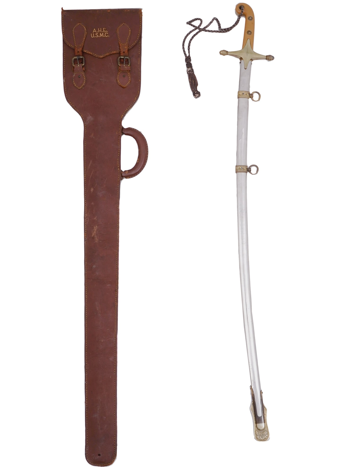 A US MARINE PARADE SWORD WITH LEATHER CARRYING CASE,: A polished steel Mameluke pattern officer sword of the type adopted by the United States Marine Corps in the early 19th century. Presented in its brown leather carrying case with its owner's initials 