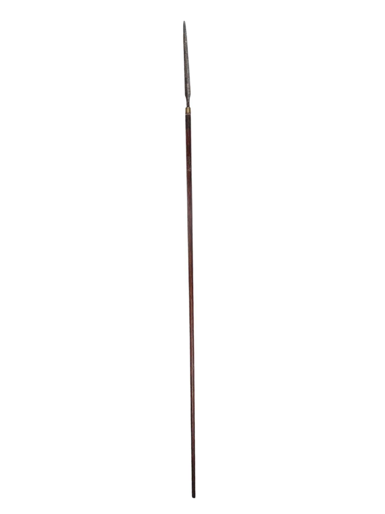 AN INDONESIAN TOMBOK SPEAR FROM JAVA OR BORNEO: Spear from Java (called “Tombok”) or Borneo. Dark brown haft without decoration. Rusty steel blade, diamond-shaped with a central ridge. No decoration on the thin blade, just a bead above 