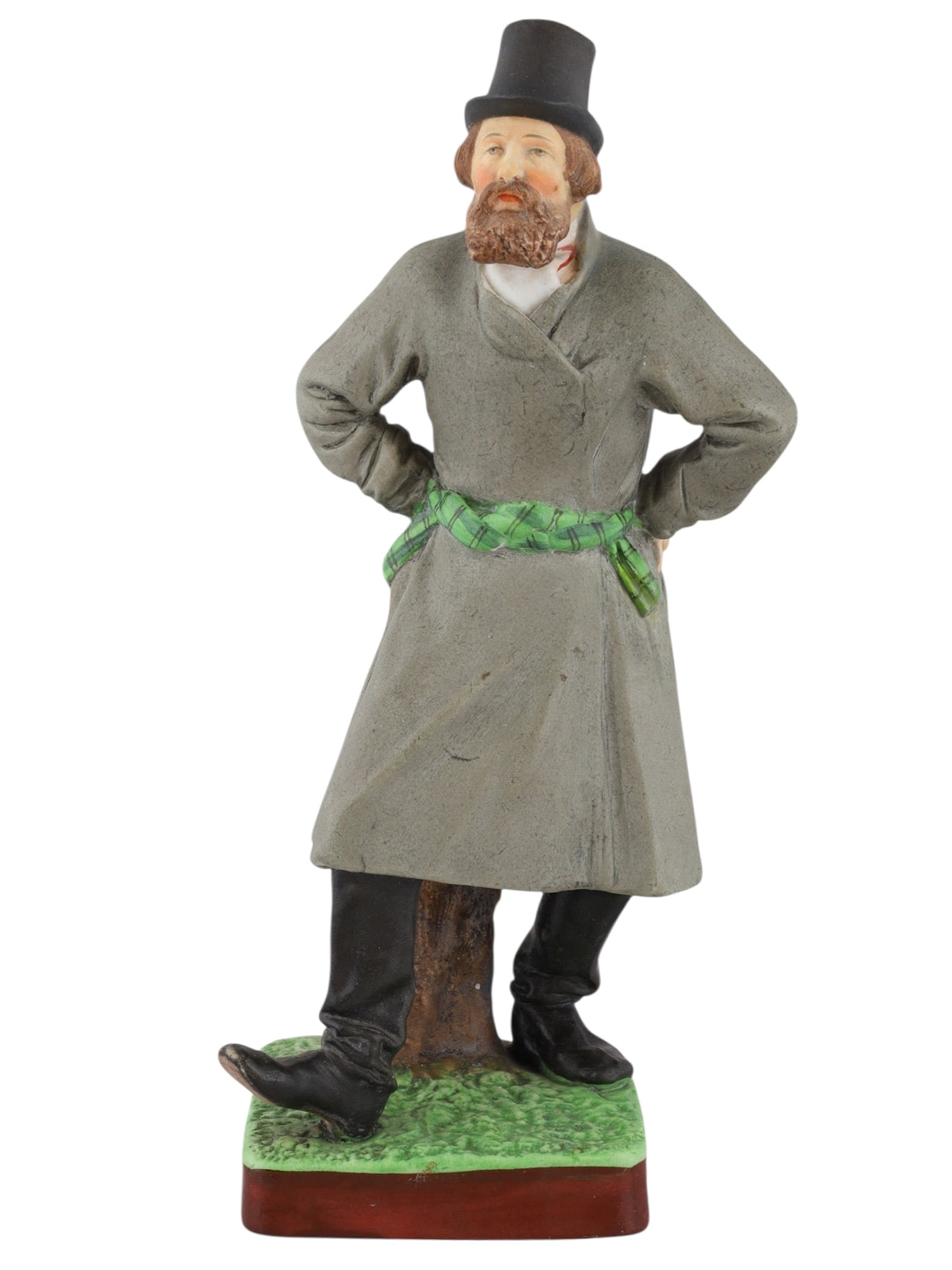 A RUSSIAN GARDNER PORCELAIN FIGURE OF A DANCING PEASANT, 19TH CEN.: A Russian porcelain figure of a dancing peasant man wearing a long grey coat and top hat, produced by the Gardner porcelain factory. The underside is marked with the red ink Gardner stamp, the impress