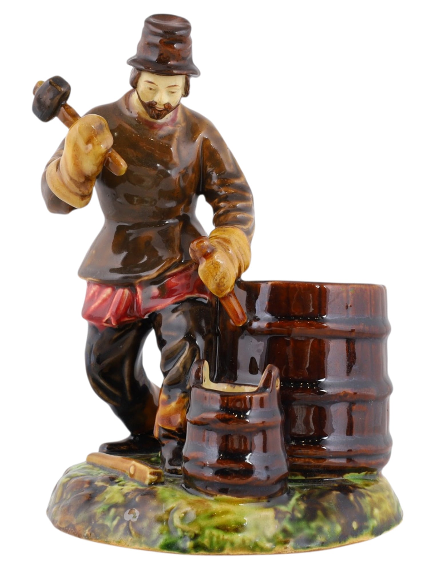 A RUSSIAN KUSNETSOV PORCELAIN FIGURE OF A COOPER, 19TH CENTURY: A Russian porcelain figure of a cooper (barrel maker) at work, hammering the rings onto a barrel. The piece was produced by the Kusnetsov porcelain manufactory and is marked on the underside with vari