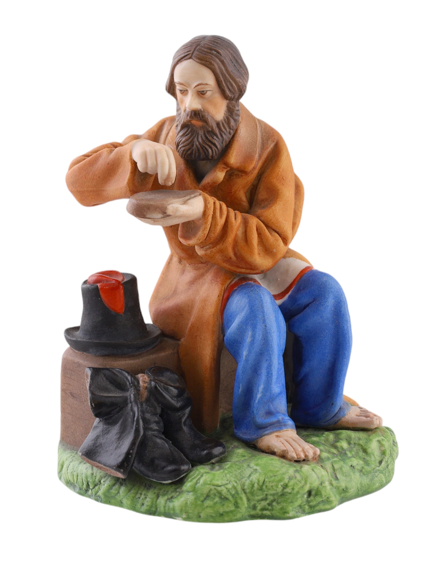 A RUSSIAN GARDENER PORCELAIN FIGURE, CIRCA 1890S: Gardner Factory, 19th century.Titled "A man with a loaf of bread," from the famous series "Pictures of People's Lives." Depicting a man in a coat, sitting on a wooden block, with his shoes and a hat n