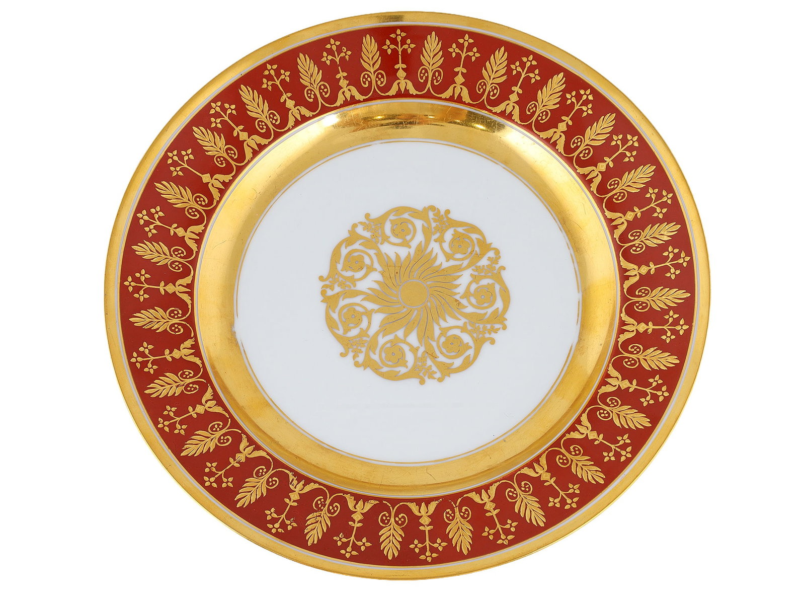 A RUSSIAN PORCELAIN PLATE FROM THE GURIEV SERVICE, IMPERIAL PORCELAIN FACTORY, 1855-1881: St. Petersburg, Imperial Porcelain Factory, 1855-1881.Russian porcelain dinner plate from the Guriev Service, period of Alexander II. The center of the plate is decorated with a gold rosette within re