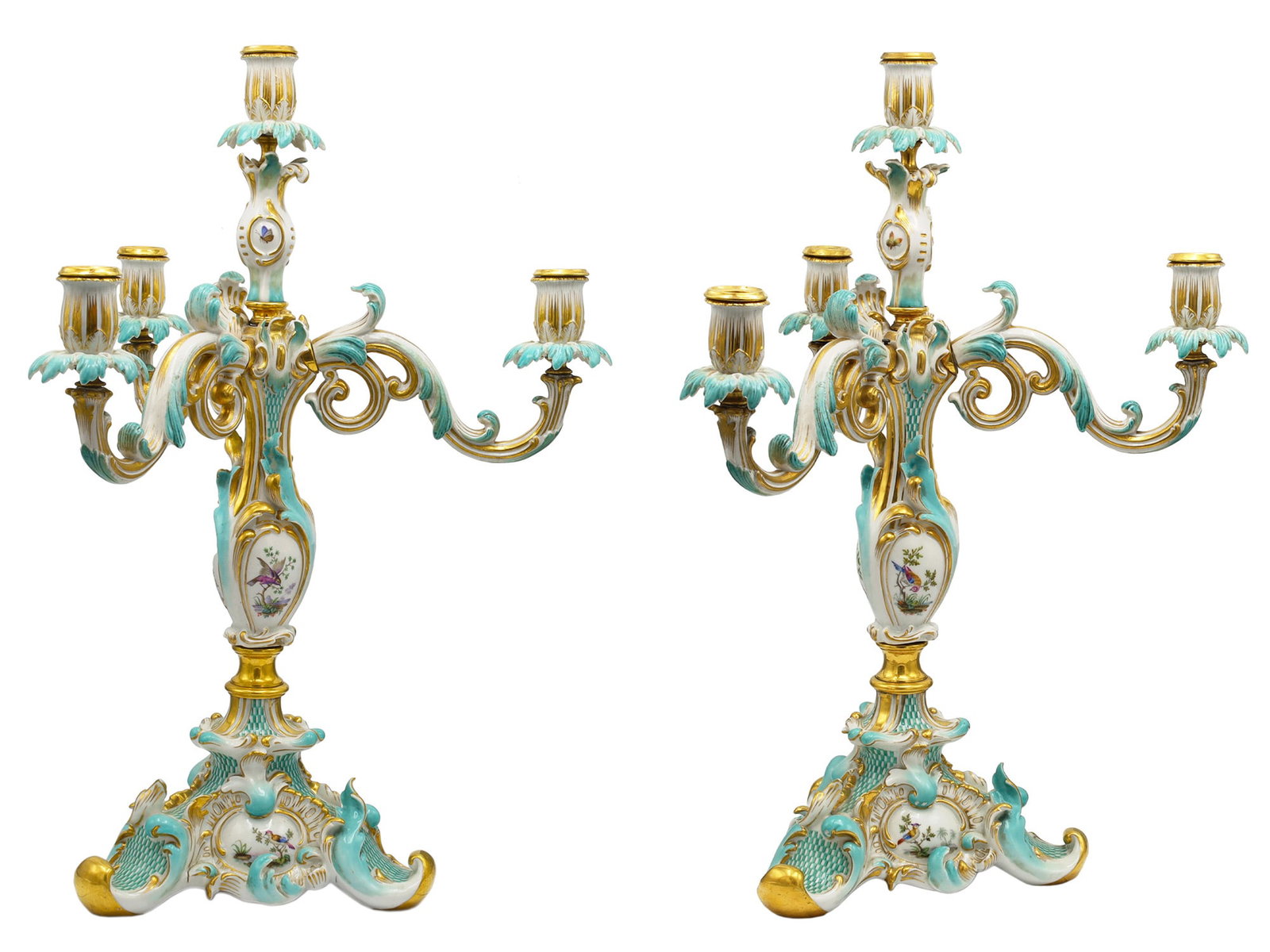 A PAIR OF RUSSIAN PORCELAIN CANDELABRA, IMPERIAL FACTORY, ST. PETERSBURG, 1825?1855: Imperial Porcelain Factory, period of Nicholas I.Each elaborately modeled in the Rococo Revival style, the shaped tripartite base enriched with turquoise trelliswork, scrolling rocaille ornament, and 