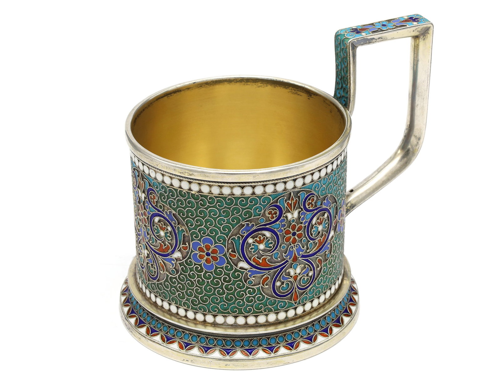 A RUSSIAN PARCEL-GILT SILVER AND CLOISONN? ENAMEL TEA GLASS HOLDER BY GUSTAV KLINGERT, 1895: Moscow, 1895. Of cylindrical form on a flared circular foot, the body decorated with scrolling silver cloisons and stylized foliate medallions in turquoise, cobalt blue, white, red and gray enamels, b