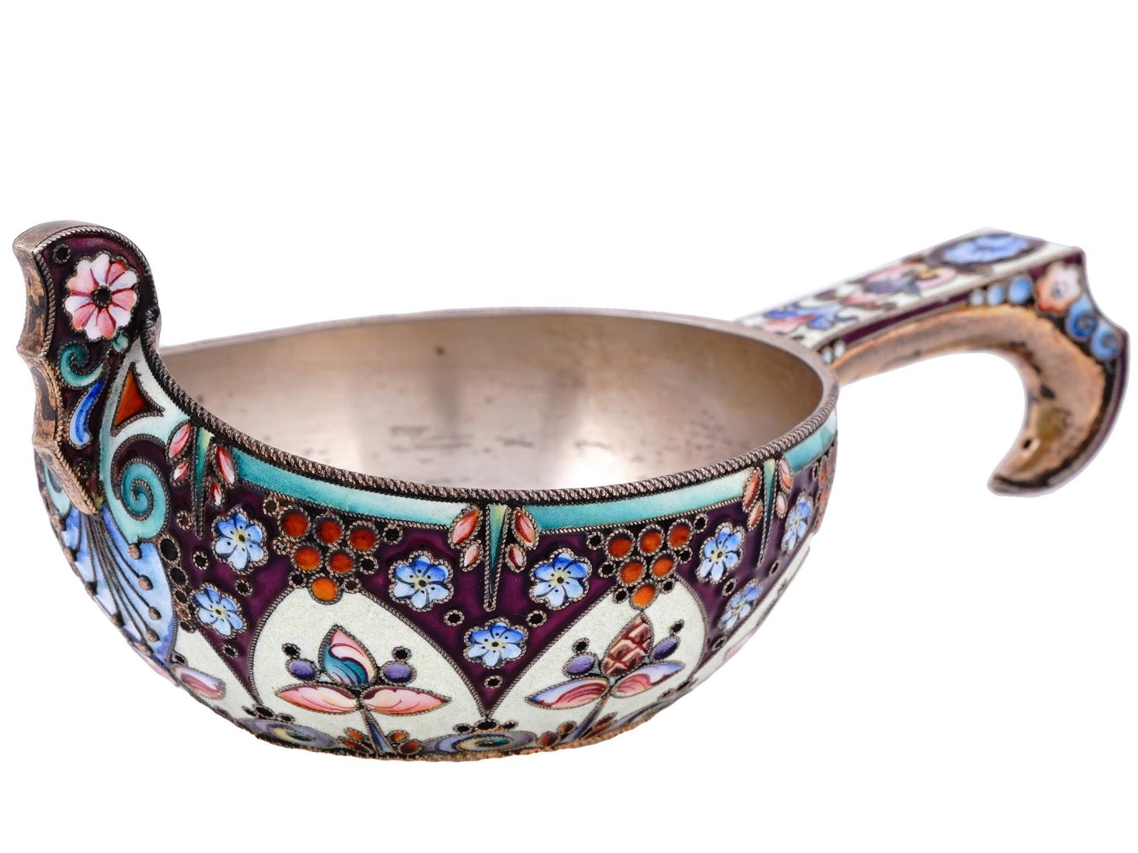 A RUSSIAN CLOISONNE ENAMEL AND SILVER KOVSH, 11TH ARTEL, 1908: 11th Artel, Moscow, 1908-1917.Of a traditional form, with a raised prow and a shaped hook handle, enameled with varicolored scrolling foliage and floral motifs.Hallmarks: 84 Russian silver standard, k