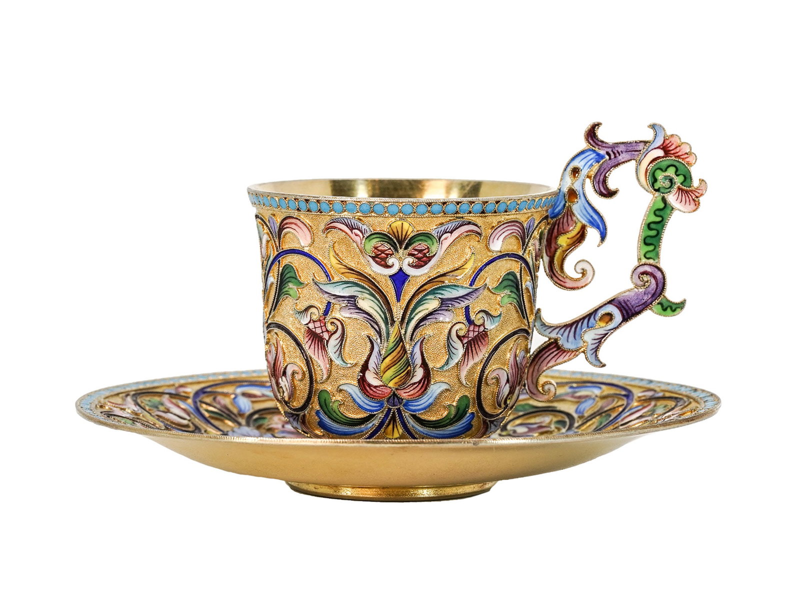 A RUSSIAN SILVER & CLOISONNE ENAMEL CUP AND SAUCER BY M. SEMENOVA, 1908-17: Maria Semenova, Moscow, 1908-1917.The cup with a flared foot and shaped scroll handle, together with a matching saucer, both superbly decorated in brightly colored, shaded cloisonné enamel on gil