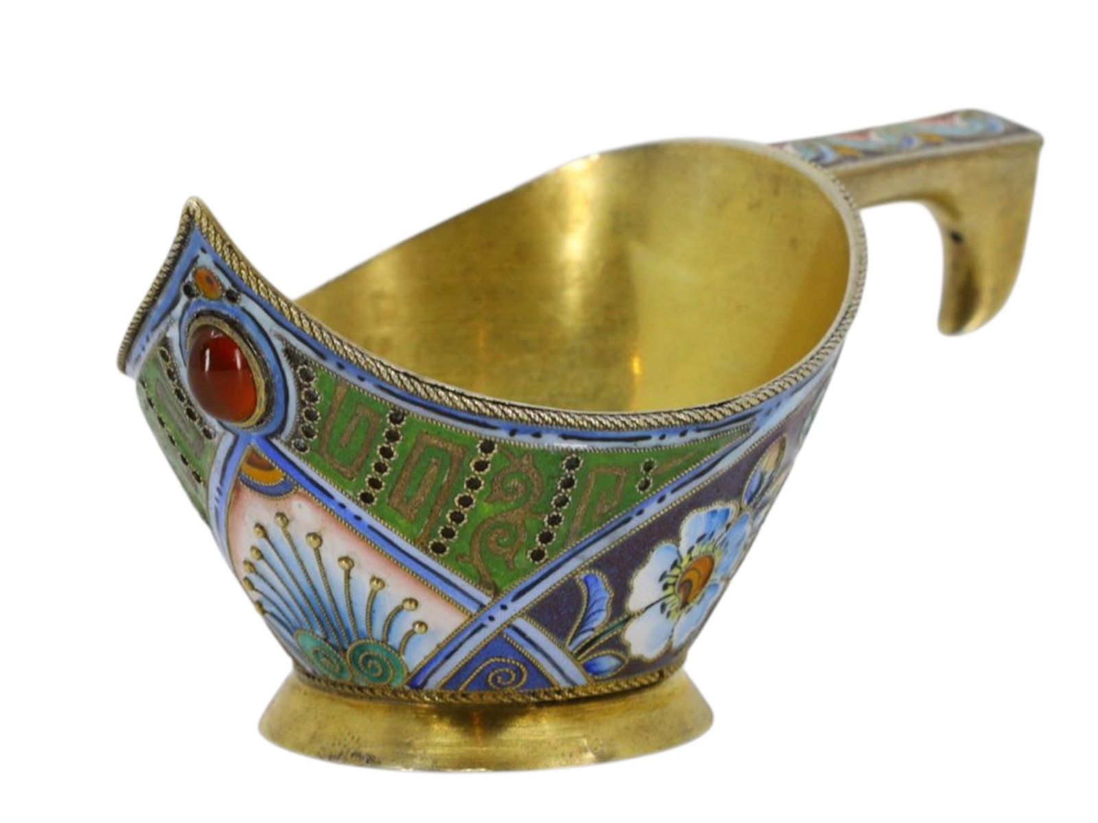 A RUSSIAN SILVER-GILT AND CLOISONNE ENAMEL KOVSH, 11TH ARTEL: 11th Artel, Moscow, 1908-1917.Of an unusual shape with a flat, elongated hooked handle. The exterior is made up of decorative panels featuring stylized floral motifs in blue, pink, green, and white en