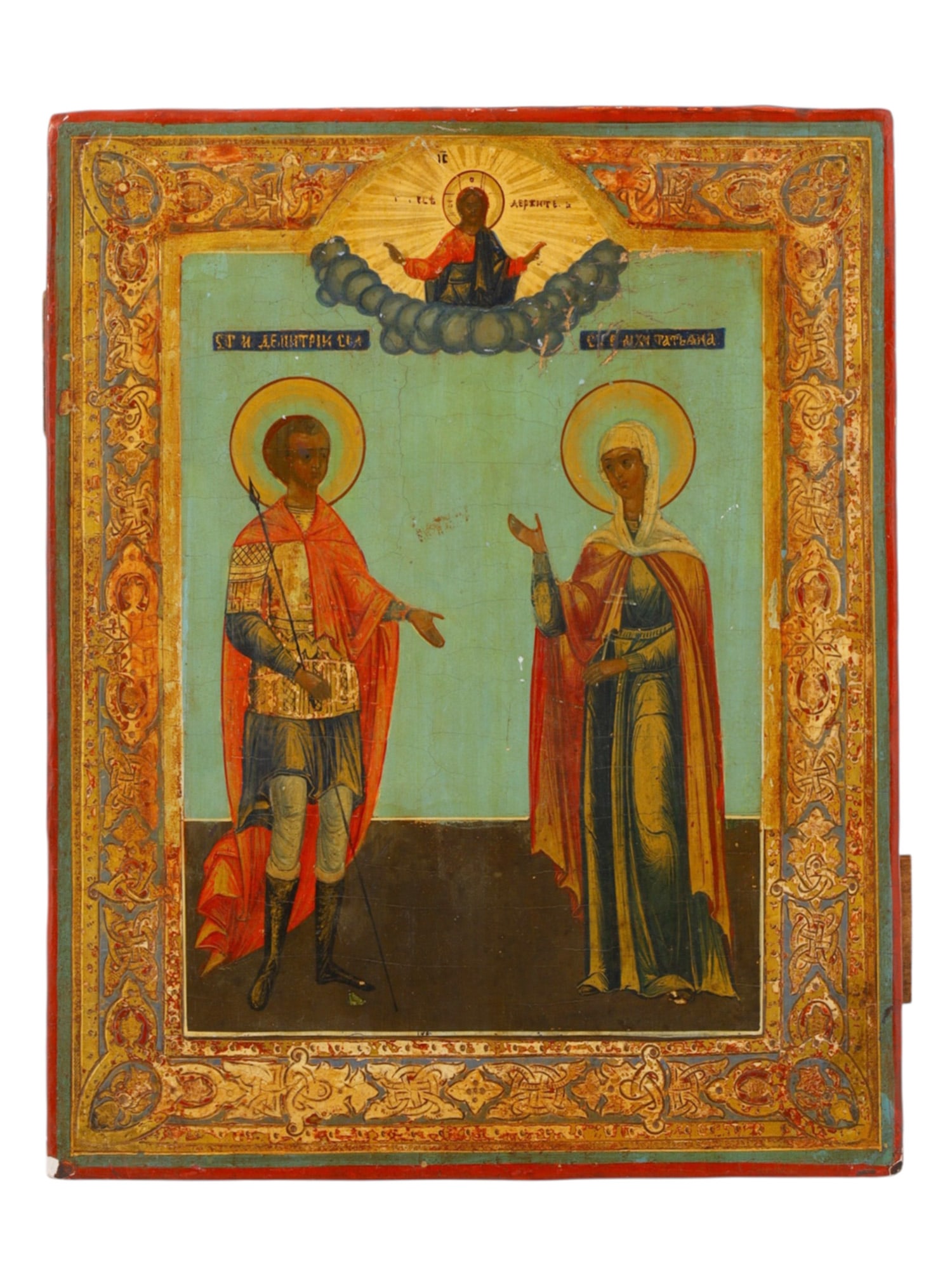 A RUSSIAN ORTHODOX ICON OF SAINTS DMITRIY AND TATIANA, 19TH CENTURY: Tempera on wood panel. The full-length figures of the Great Martyr Demetrius of Thessaloniki and the Holy Martyr Tatiana stand against a pale blue ground, identified by Church Slavonic inscriptions. C