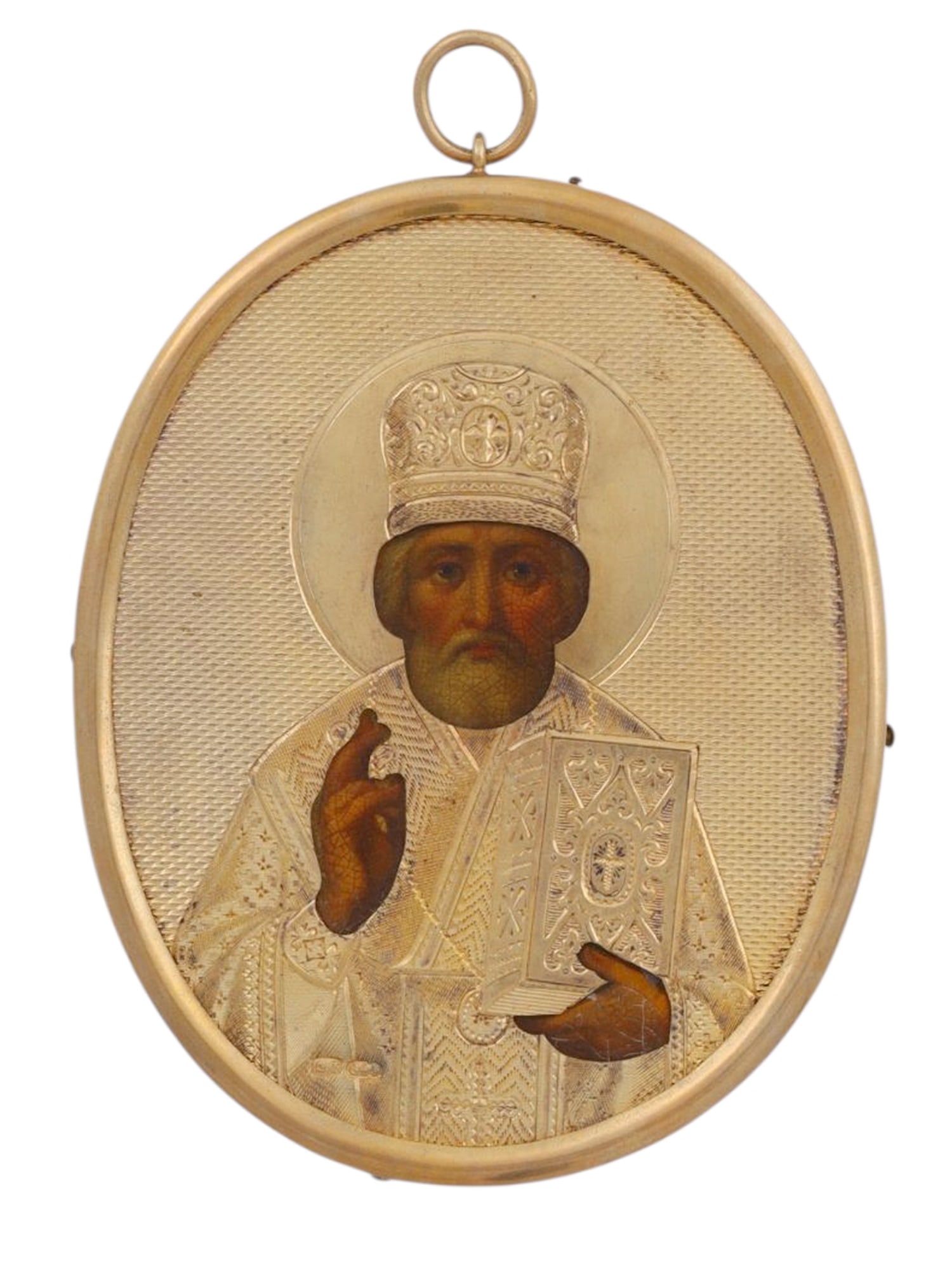 A RUSSIAN ICON OF ST NICHOLAS, SILVER RIZA, 1882-99: St. Petersburg, 1882-1899.Russian icon of Saint Nicholas presented in an oval gilt-silver oklad with a textured ground. The mitre is decorated with raised ornamentation, including a small central cros
