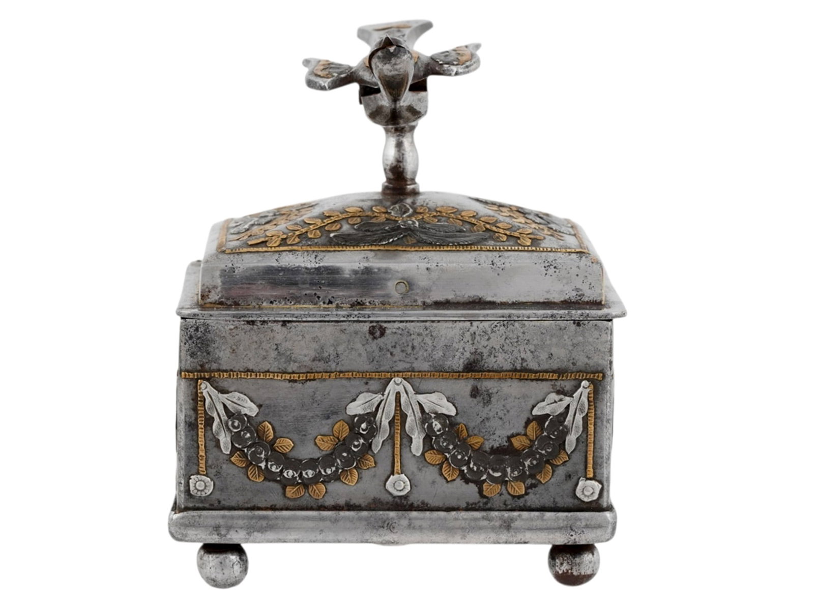 A RARE RUSSIAN PARCEL-GILT TULA STEEL SEWING BOX WITH BIRD-FORM THREAD HOLDER, CIRCA 1810: Russian, Tula, early 19th century.The rectangular polished-steel sewing box raised on four ball feet, its sides applied with floral swags suspended from drapery and rosettes, enriched with gilt-metal 