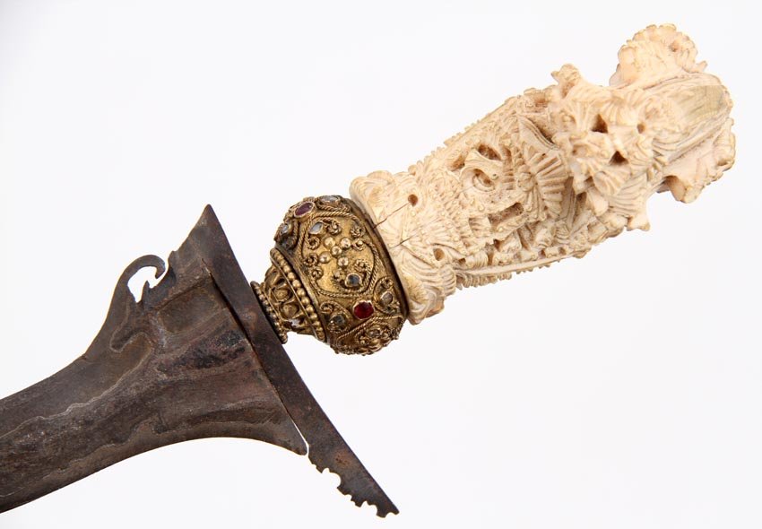 RARE INDONESIAN KRIS DAGGER WITH DIAMONDS & RUBIES: Rare example with a very fine carved ivory grip set with a number of small diamonds and rubies at the gilded silver or brass mount as an indication of higher class of the dagger and its owner's rank. 