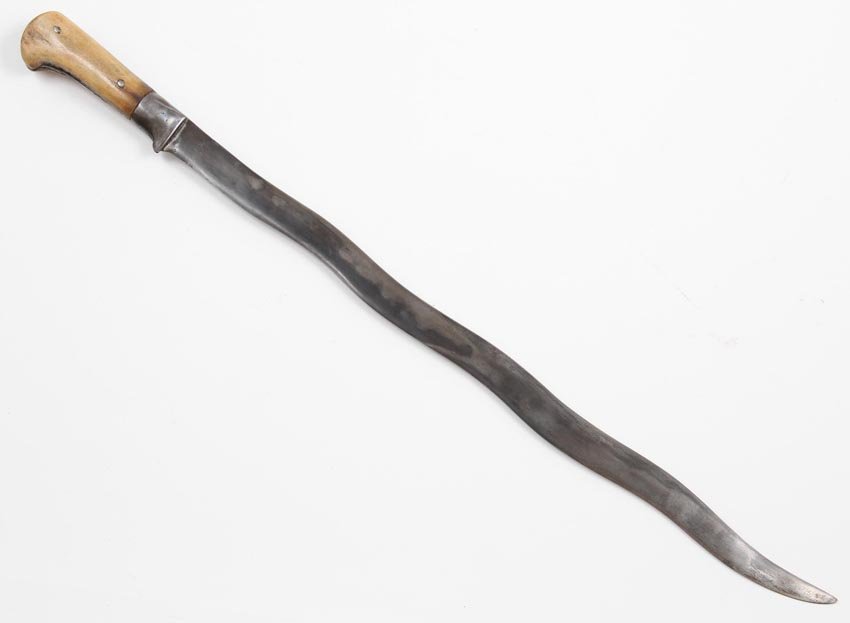 CENTRAL ASIAN (BUKHARA) DAGGER, 19 C.: 19th cen. Central Asian (Bukhara) dagger with Damascus steel flamboyant blade. Bone grip with steel band holding the ivory scales together. Overall length is 28" (71 cm).