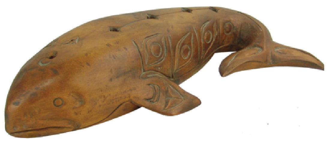 Salish Whale Carving - Simon Charlie (1920-2005): Ca. 1980, Hand carved cedar wood whale figure with curved tail and deep oiled finish. Very good condition. 19"