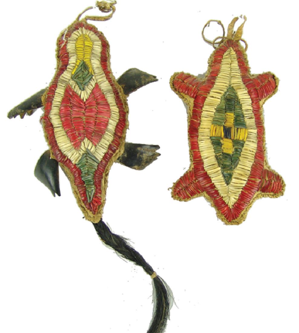 2 Quilled Fetishes: Mid 1900s, Rare pair of shaped and stuffed rawhide fetishes done in turtle form, the tops decorated with dyed and sinew sewn porcupine quills. Very good condition, nice patina. 2-1/2" x 6"