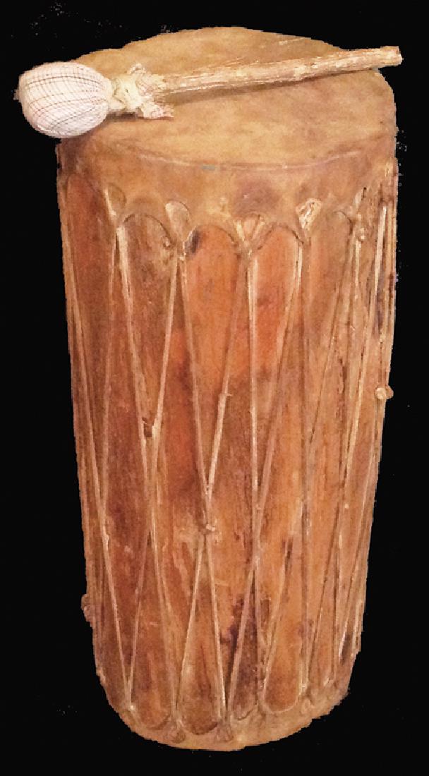 Pueblo Drum: Ca. 1940s-1950s, Tall vintage Taos-style hand crafted log drum with stretched rawhide heads. Comes with beater. Good usable condition, great condition. 24" x 9"