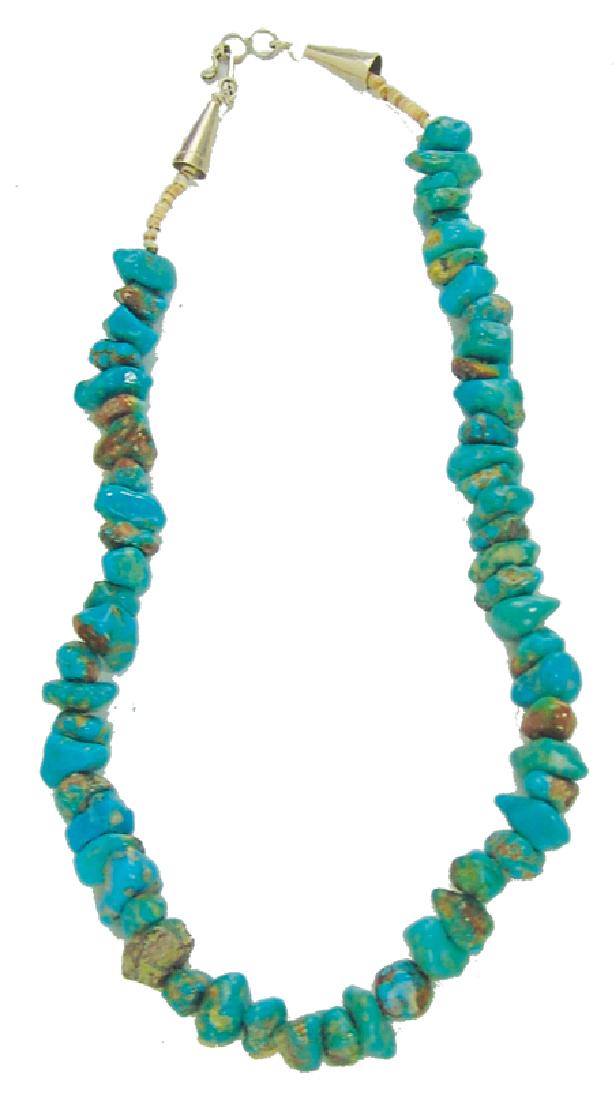 Turquoise Nugget Chocker: Ca. 1980s, Small turquoise nugget choker with silver cone tips. Very good condition. 15"