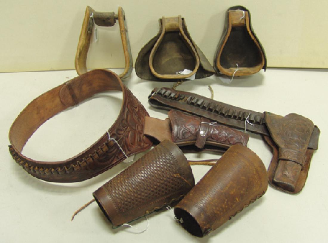 Western Box Lot: Various Ages, Collection of Western leather goods including a pair of wrist cuffs with stamp work, three wooden stirrups (two with leather toe guards) tagged as US Army McClellan, a tooled gun holster