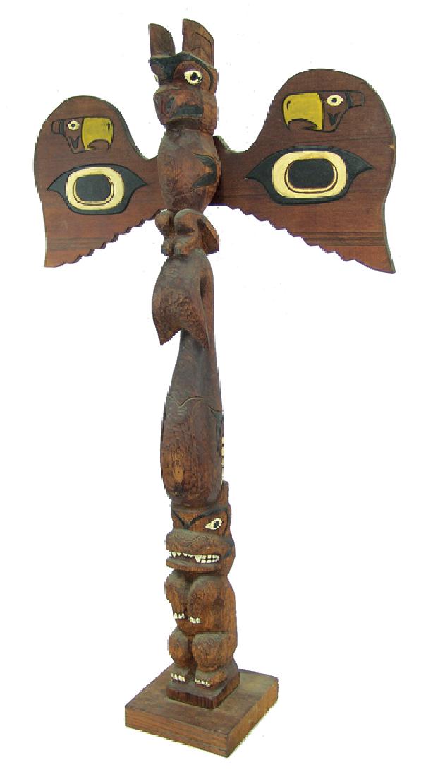 NW Coast Totem Pole: Early/Mid 1900s, Interesting hand carved and painted vintage red cedar totem pole depicting a bear, whale, and eagle with outstretched wings. Very good condition, nice patina. 41" tall