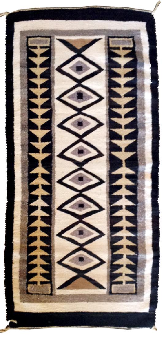 Navajo Rug/Weaving: Ca. 1950s, Runner shaped floor rug made of homespun vegetal dyed wool with bold geometric pattern. Very good condition. 57" x 28"