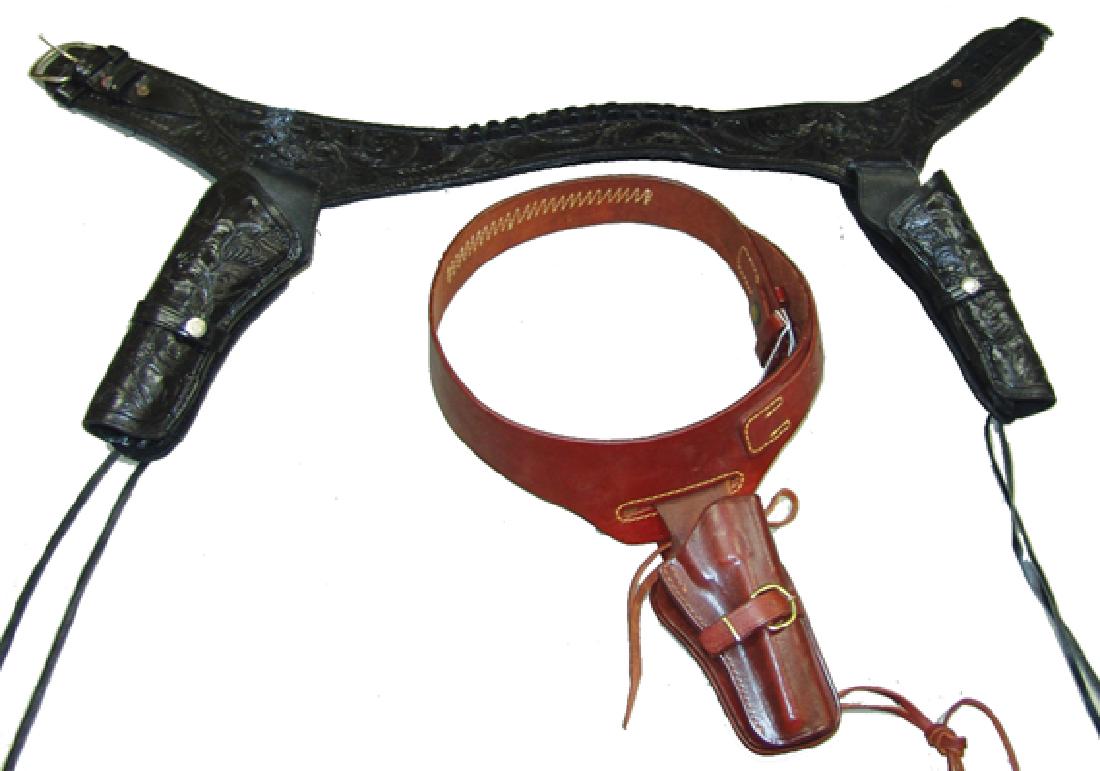 2 Western Holsters: Including a size 38" tooled black double holster with 44/45 caliber ammo belt, plus a size 32" "Triple K" 22 caliber leather holster and cartridge belt with brass wells forgo buckle. Both very good co