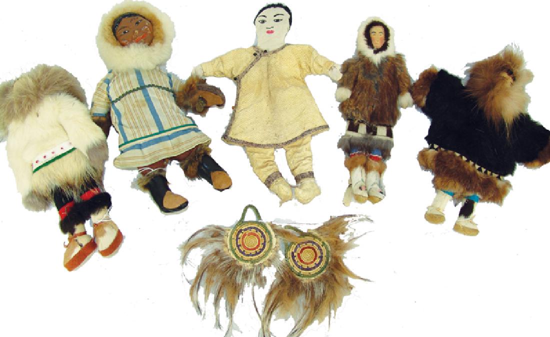Group of Eskimo Dolls, Etc.: Including a very rare example made from salmon skin, three traditional versions made from seal skin, and fur, and one cloth doll with leather boots and clay face, plus a pair of traditional finger fan