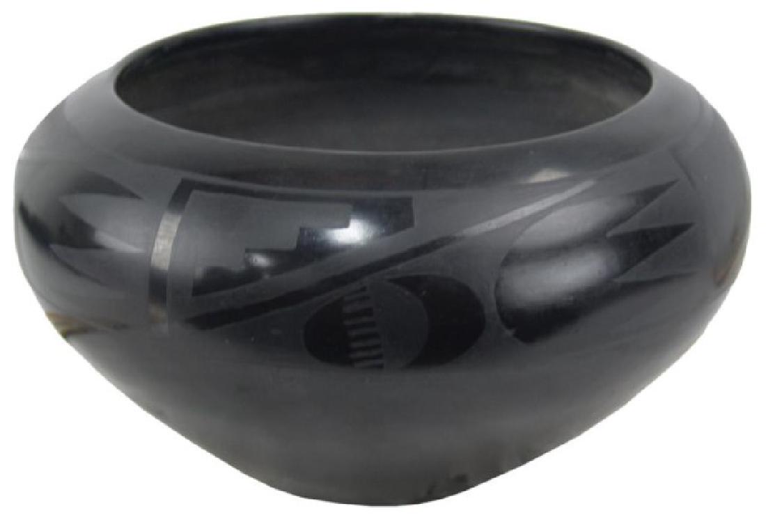 San Ildefonso Pottery - Maria Martinez (1887-1980): Huge early black-on-black pottery bowl with traditional inspired design band just below the rim. Maria told the collectors at the time that this was the largest she had ever made. Very good condition.
