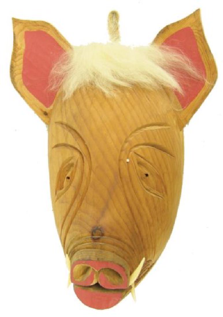 Iroquois False Face Mask: Interesting, hand carved and painted, solid wood false face pig mask, with curved ears and protruding teeth. Very good condition.,,15"